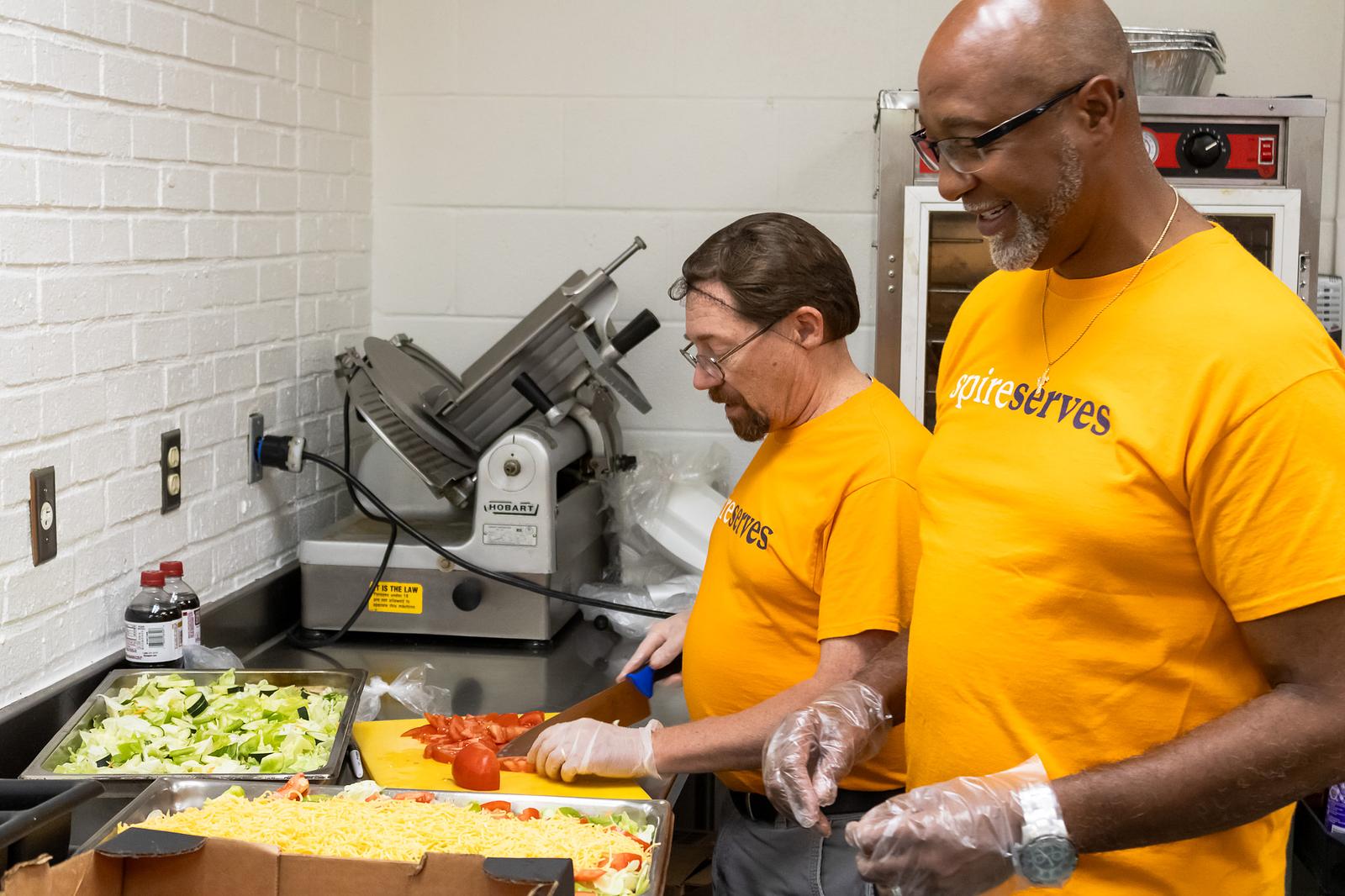 volunteers serving food