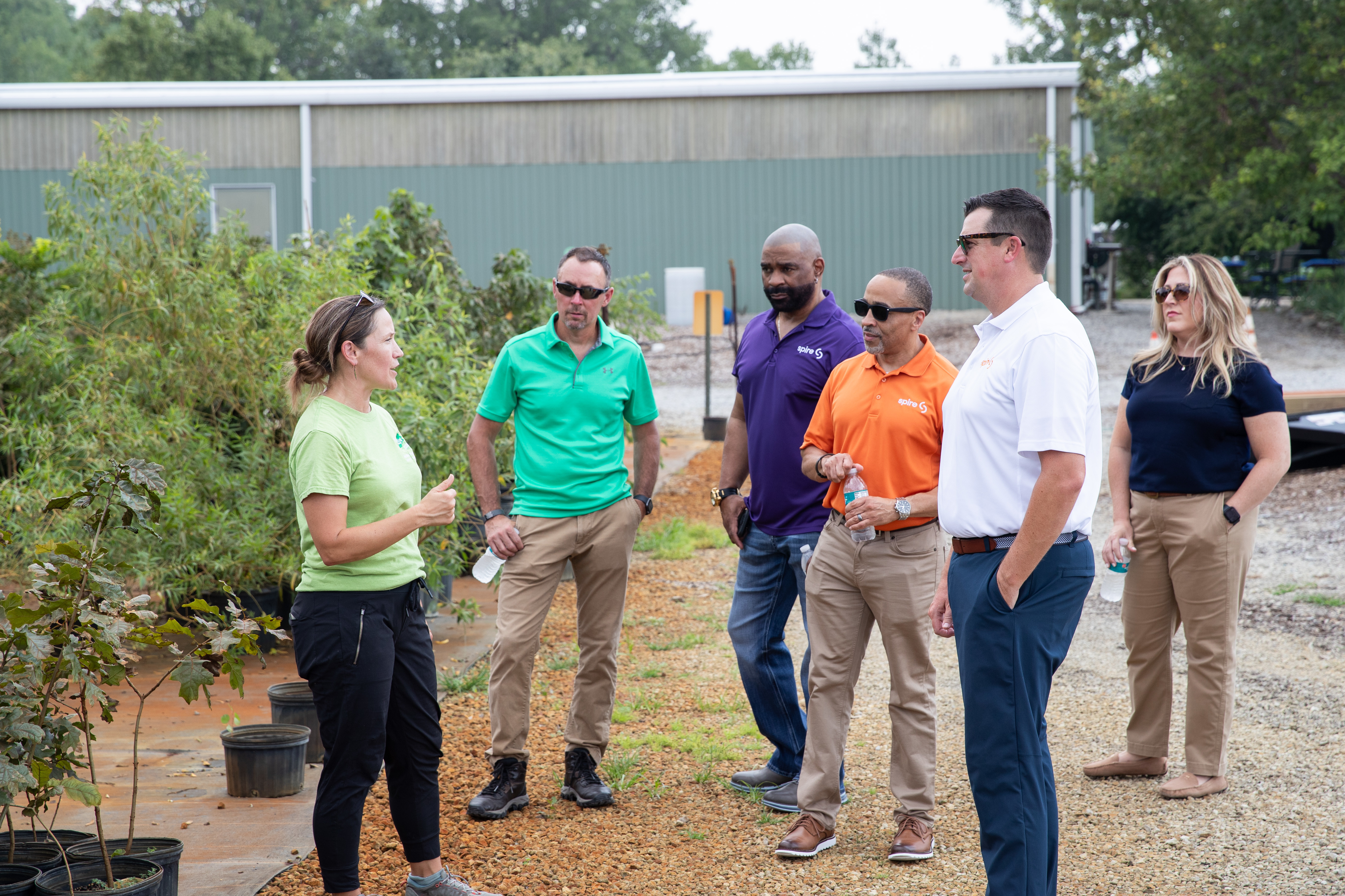 Image of Spire employees touring Forest ReLeaf's arboretum