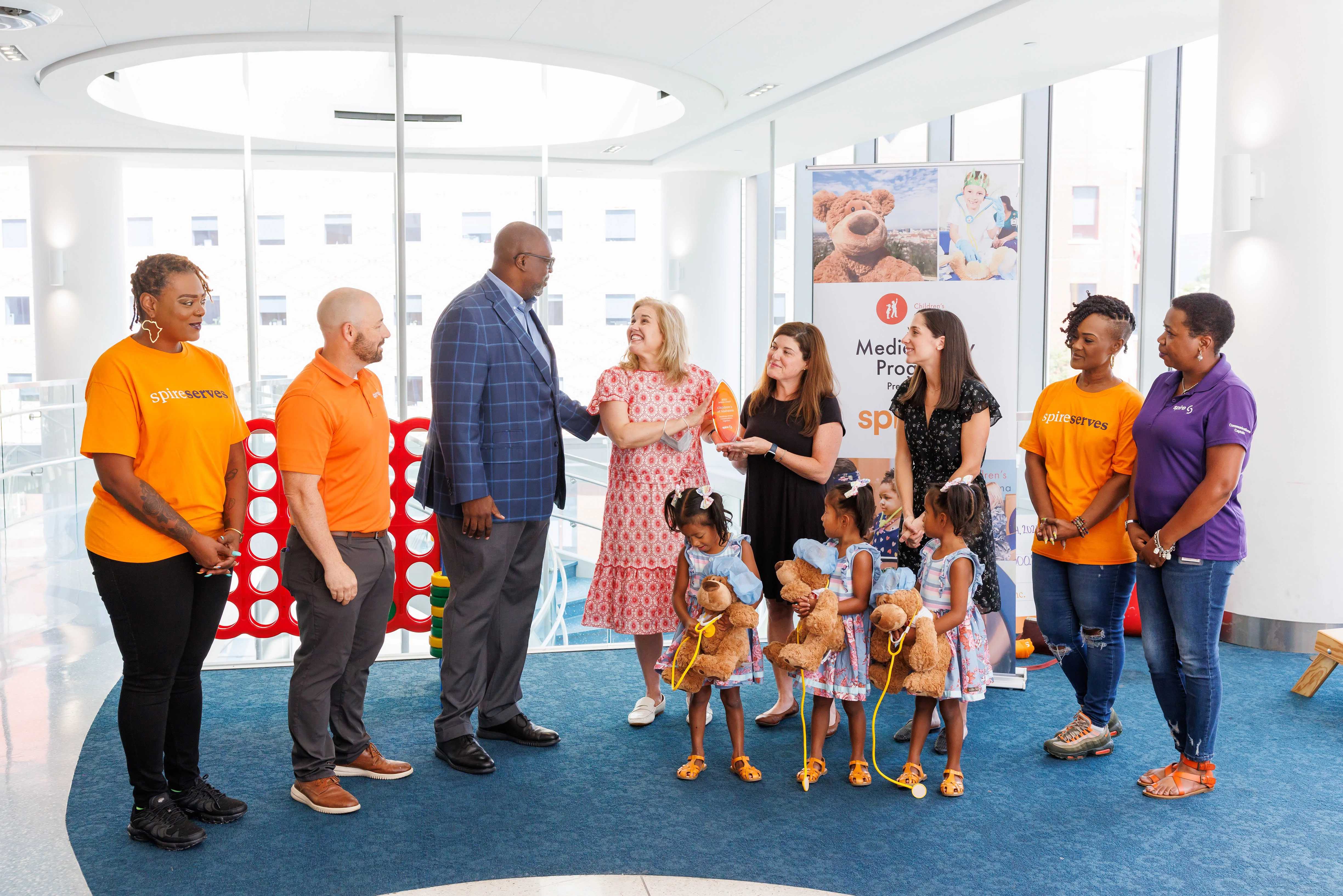 Image of Spire employees and Children's of Alabama patients 