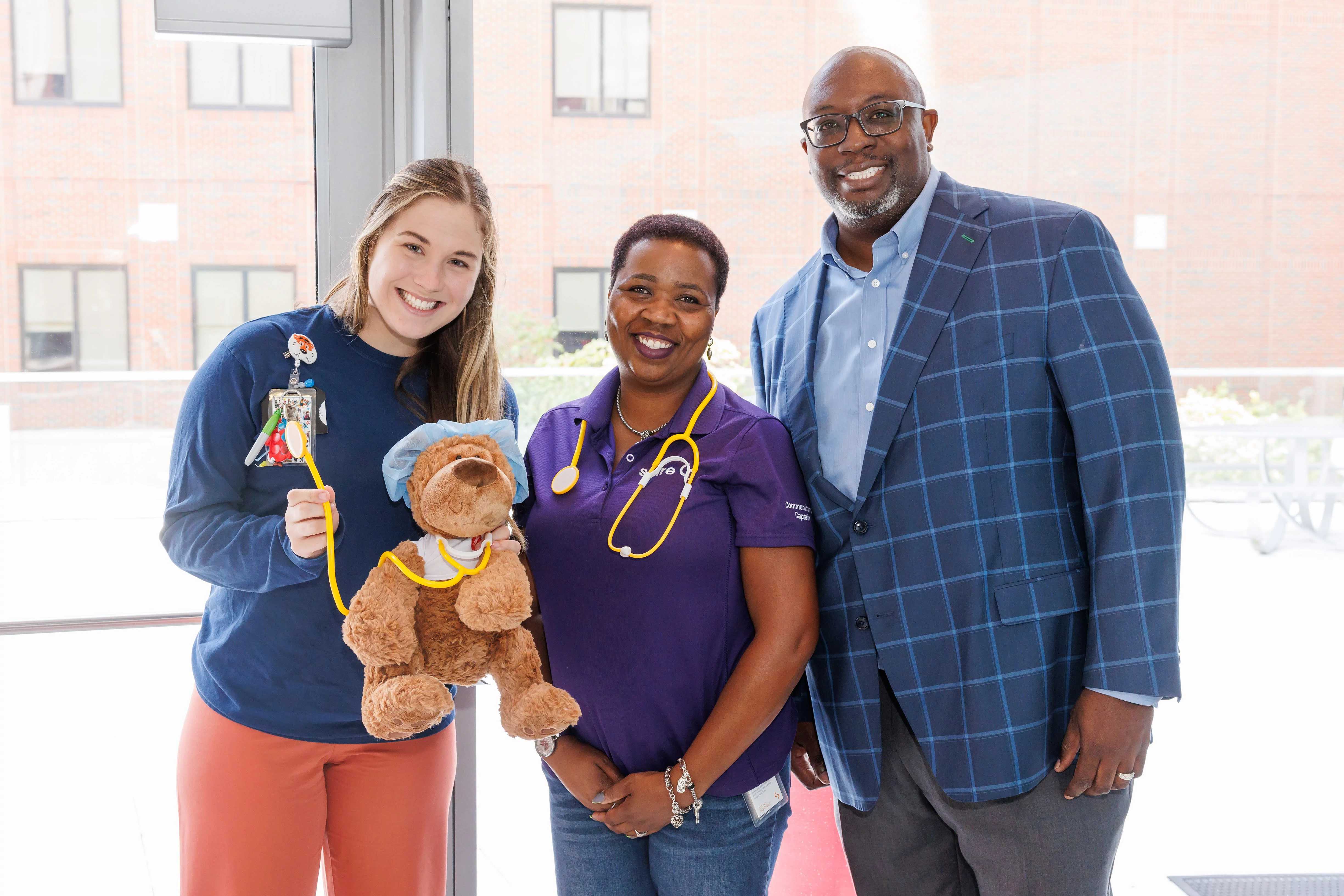Image of Spire employees with Children's of Alabama Child Life Specialist
