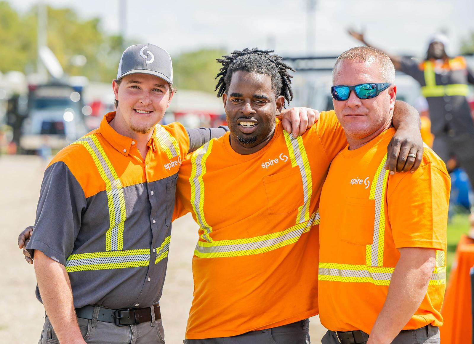 Image of three Spire employees in their uniforms