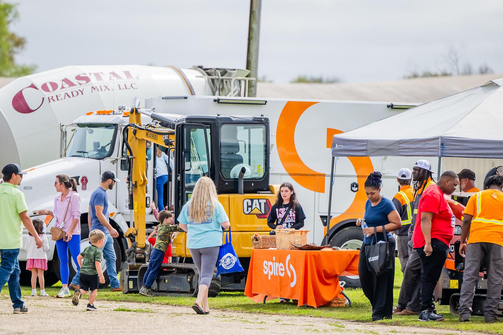 Image of event field. The Spire table and truck are on display.