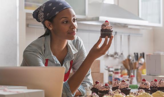 Woman baking cupcakes