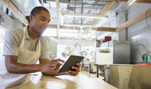 Business owner on tablet