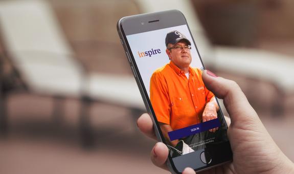 Spire employee on phone background