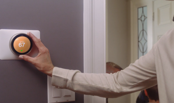 Customer adjusting smart thermostat