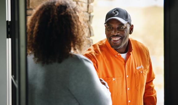 Spire technician greeting customer