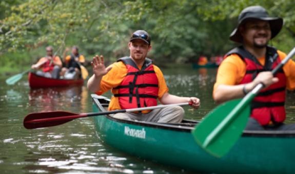 Image of Spire employees in canoes on Cahaba River in Birmingham, AL