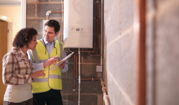 Image of contractor walking through home improvements with homeowner