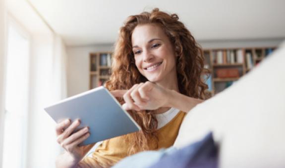 Woman doing some online shopping on her tablet