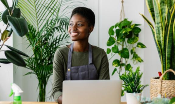 Image of person in front of plants