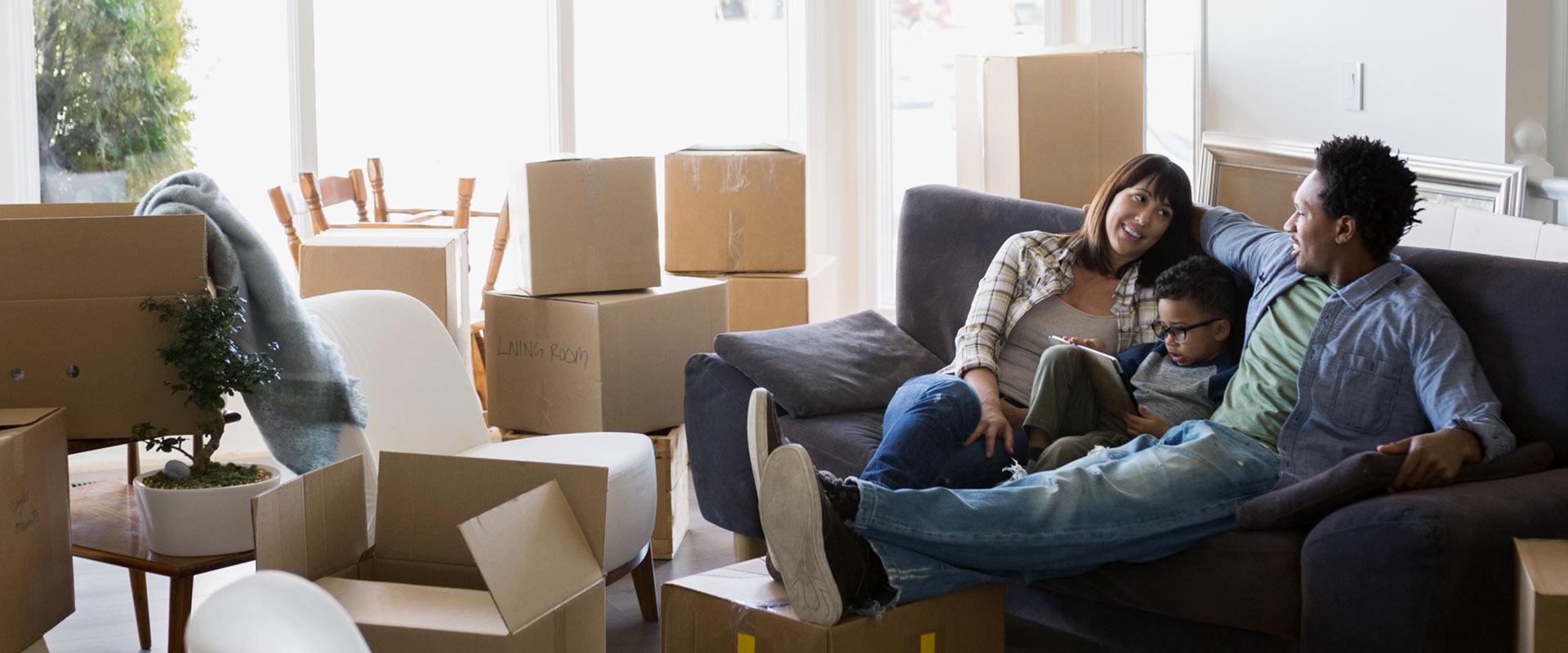 Family unpacking boxes