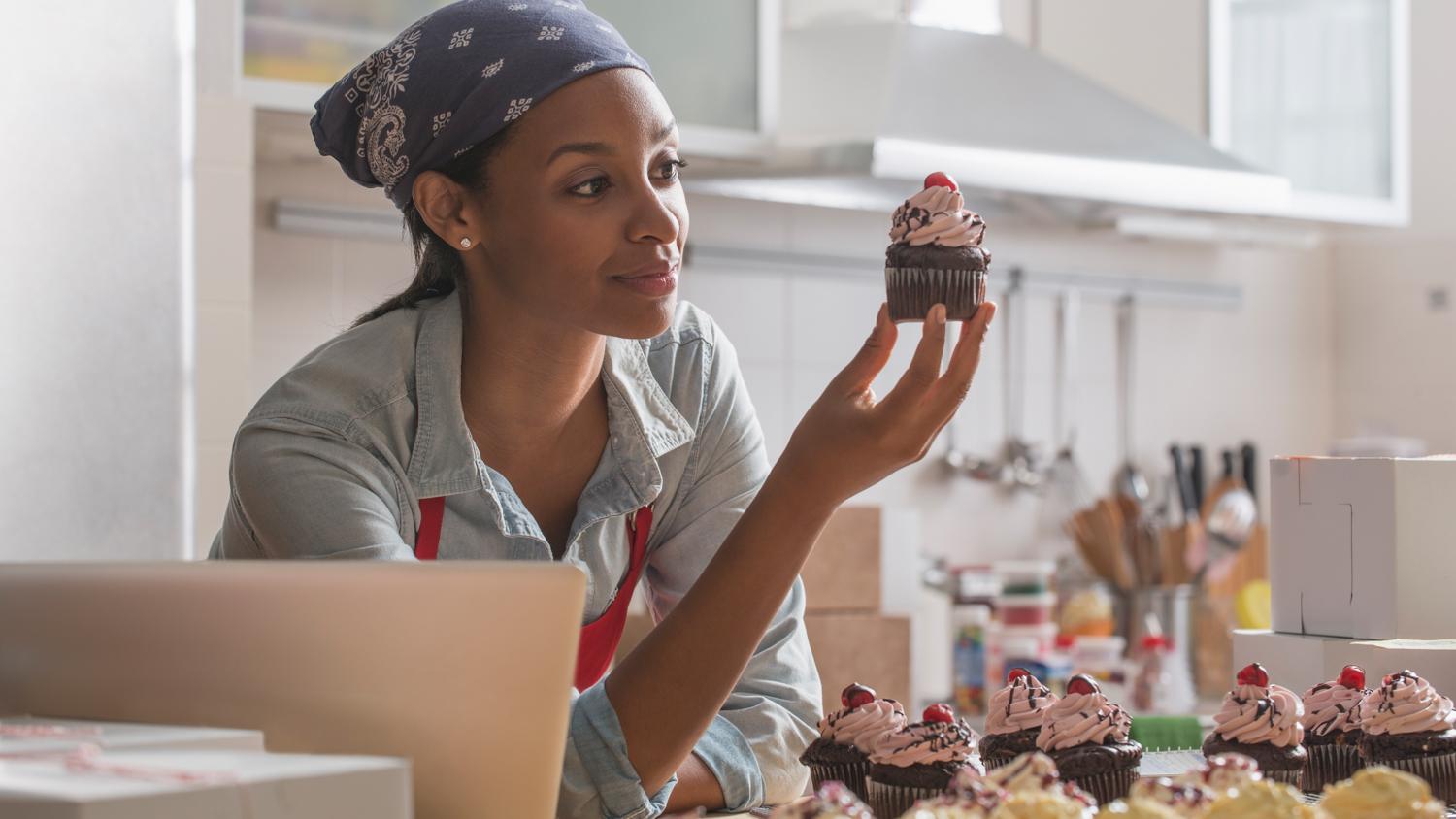 Woman baking cupcakes