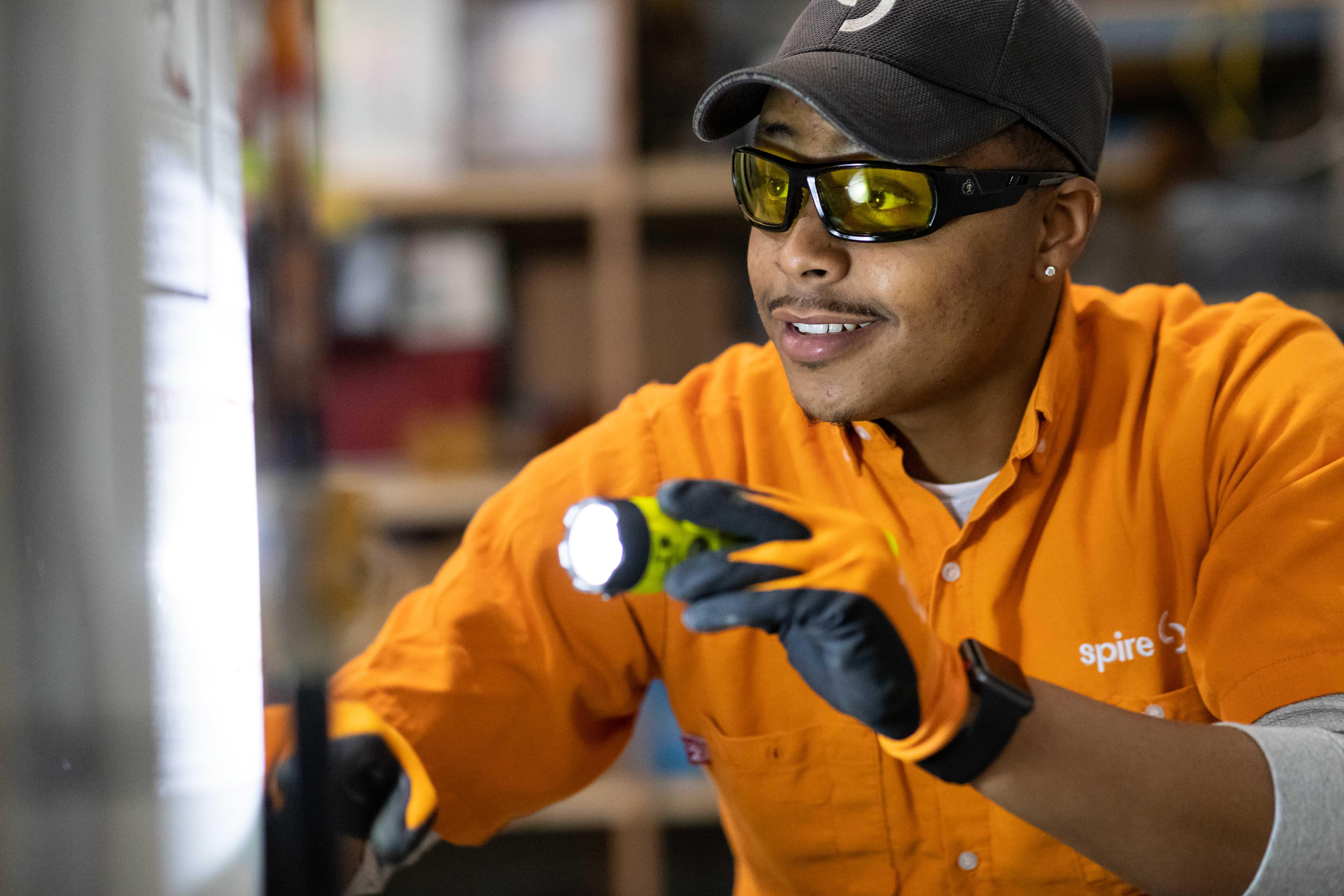 Spire employee inspecting a furnace