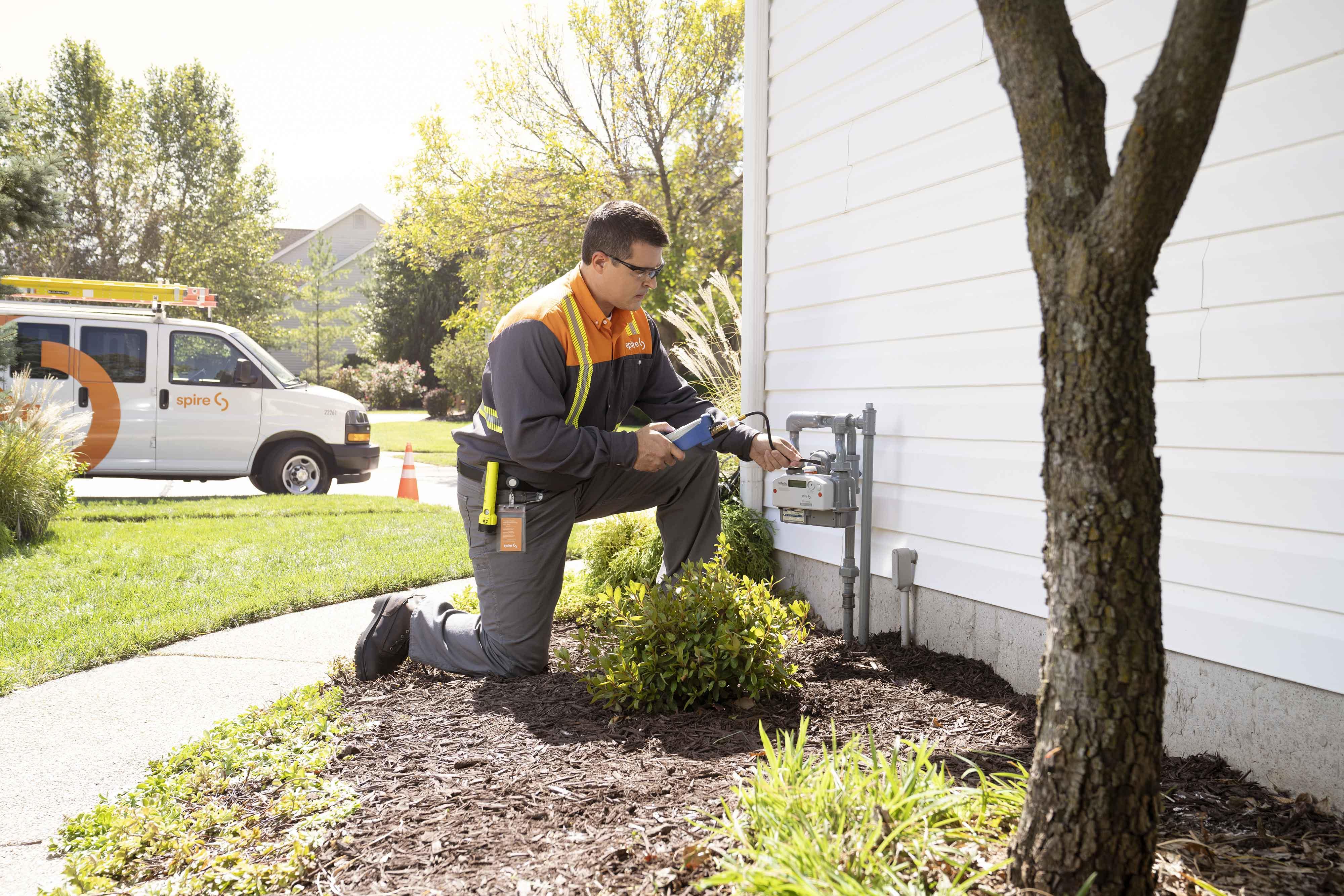 Image of: Spire employee working in the field