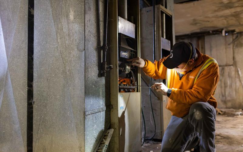 Image of Spire employee fixing a furnace
