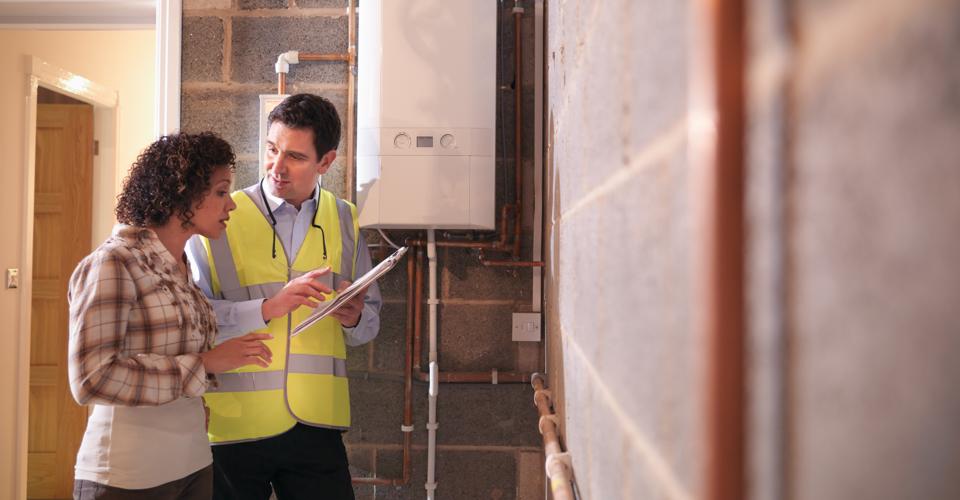 Image of contractor walking through home improvements with homeowner