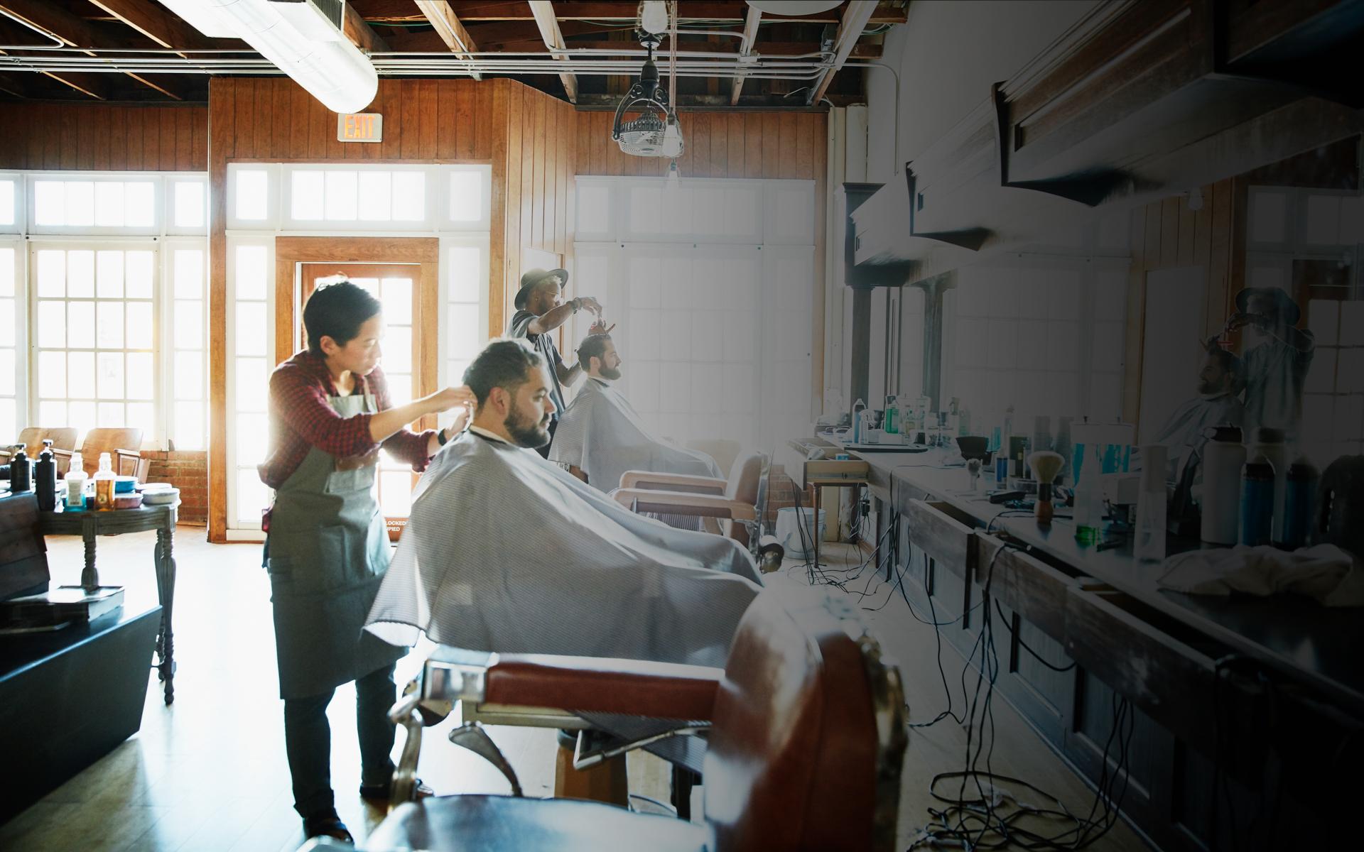 Image of person getting their haircut in a barber shop
