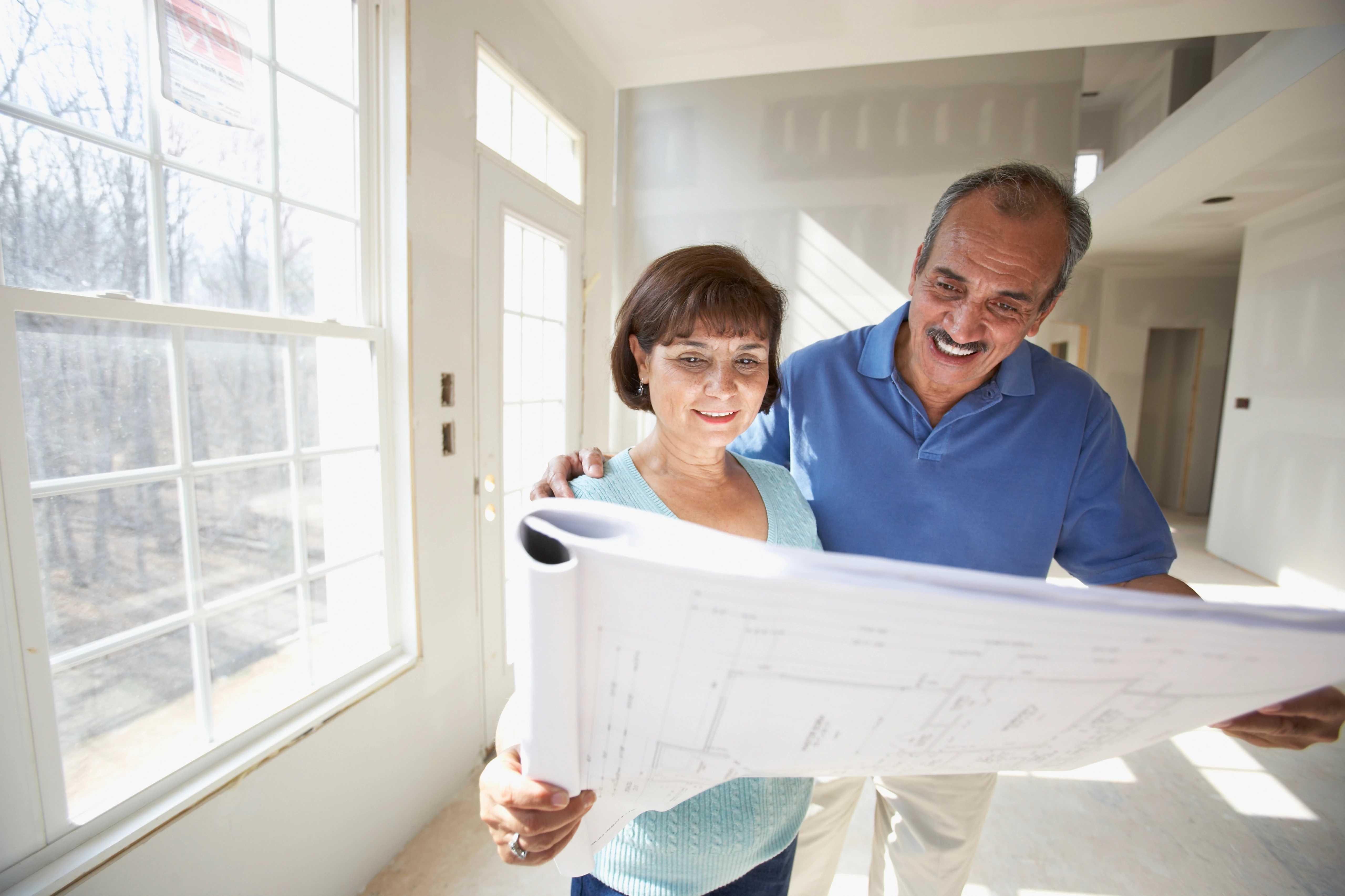 Image of man and a woman looking at plans