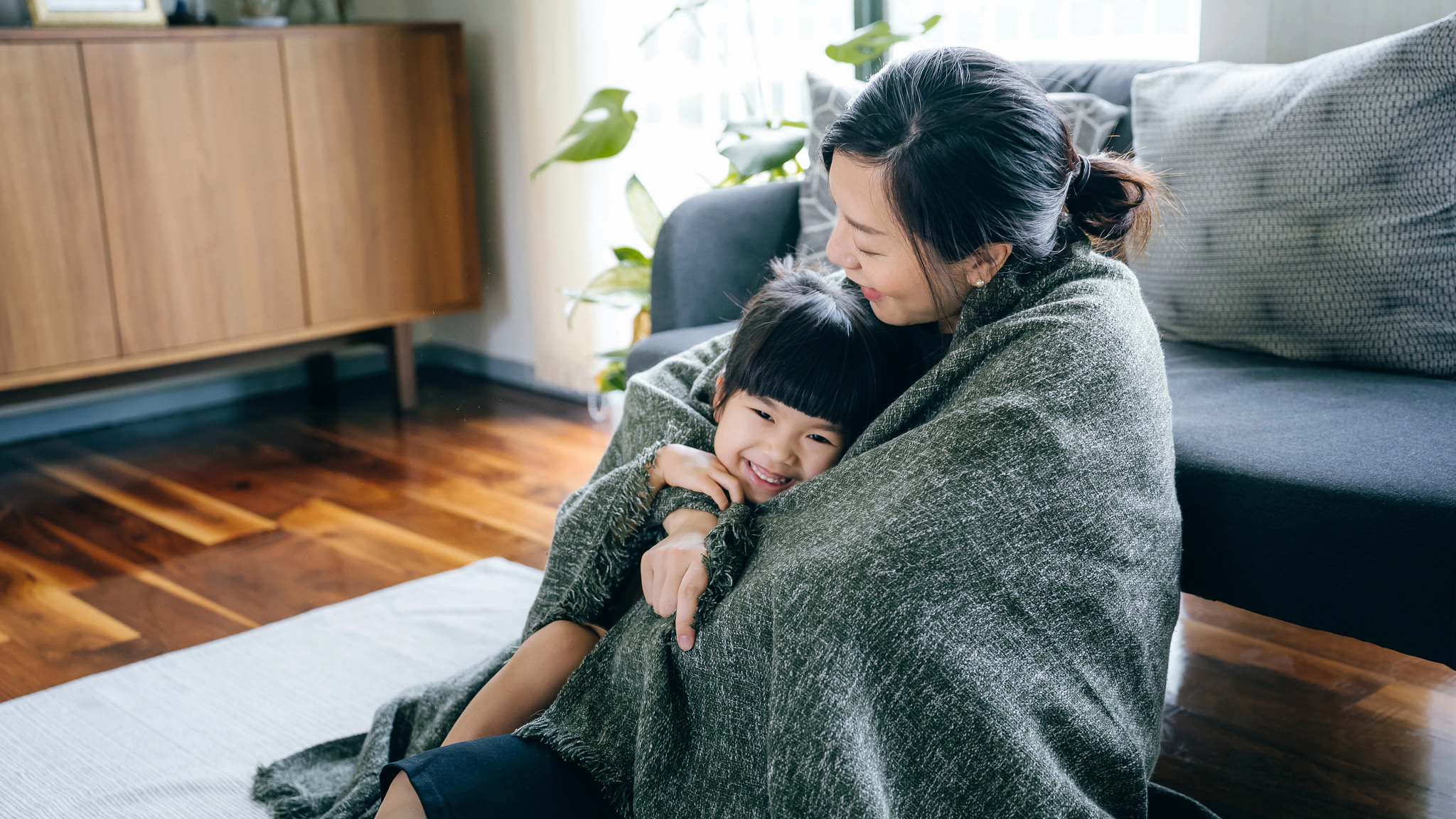 Image of mother and daughter in living room