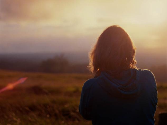 Image of woman looking over the horizon