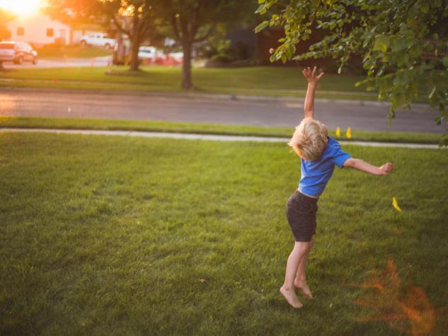 Image of little child playing in the yard